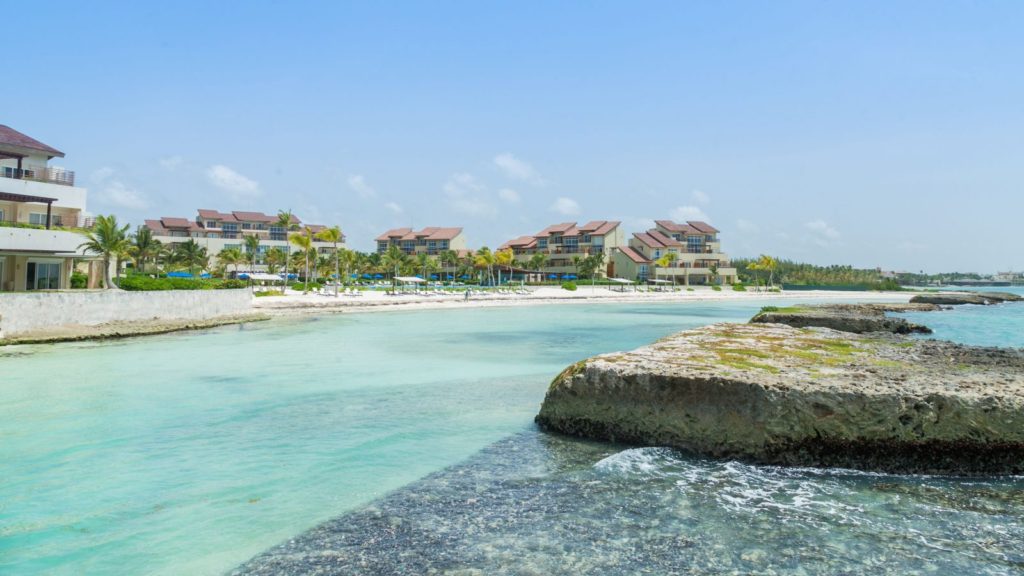 A beach with many buildings and water