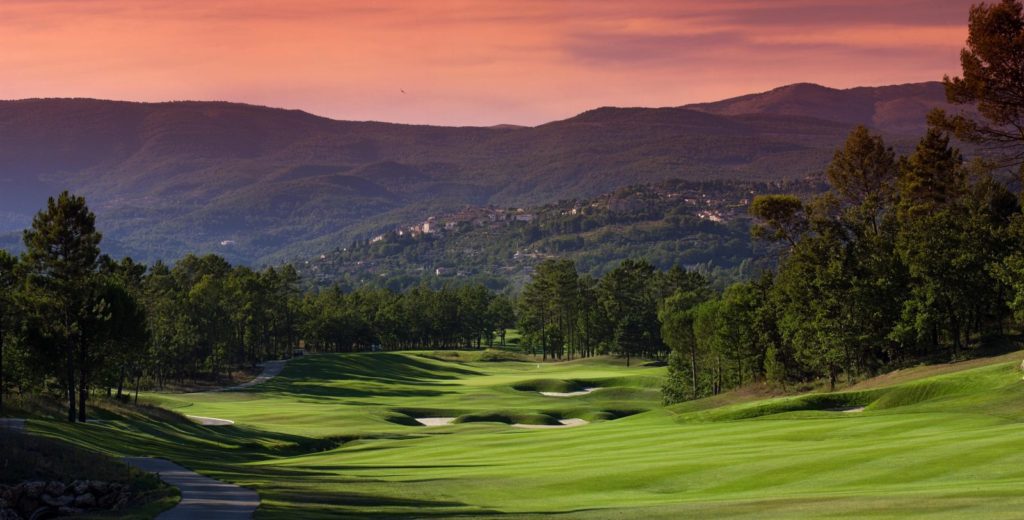 A view of the golf course at sunset.