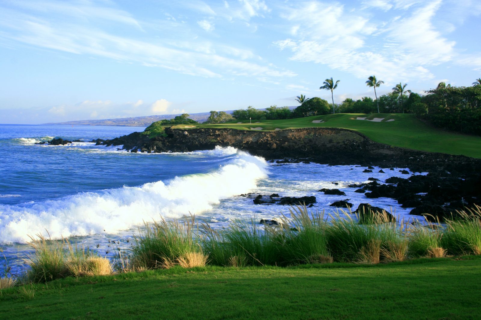 A view of the ocean from an island golf course.