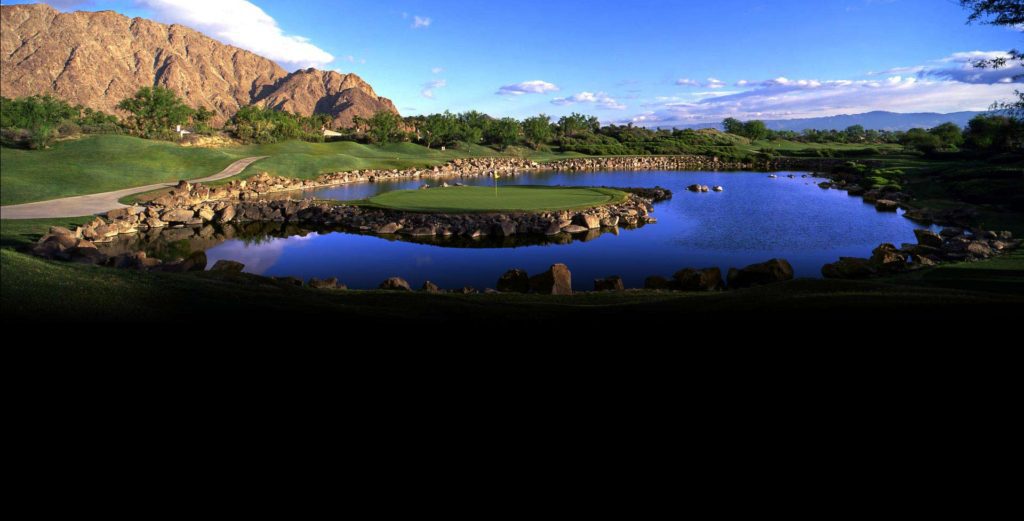 A view of the golf course from across the water.