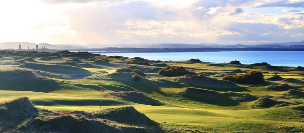 A view of the ocean from a golf course.