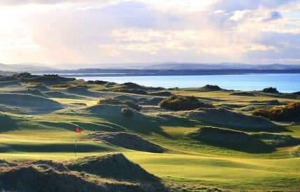 A view of the ocean from a golf course.