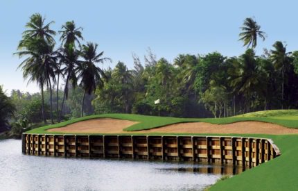 A golf course with trees and water