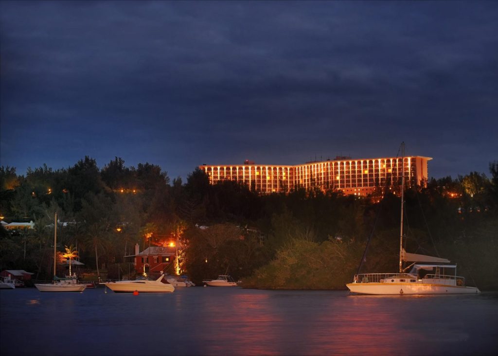 A large building with lights on top of it.