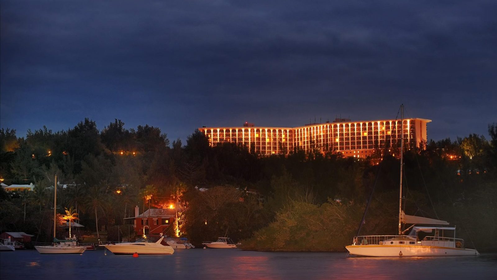 A large building with lights on top of it.