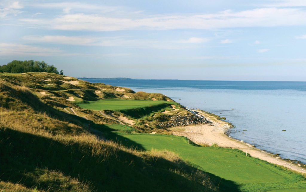 A view of the ocean from a golf course.