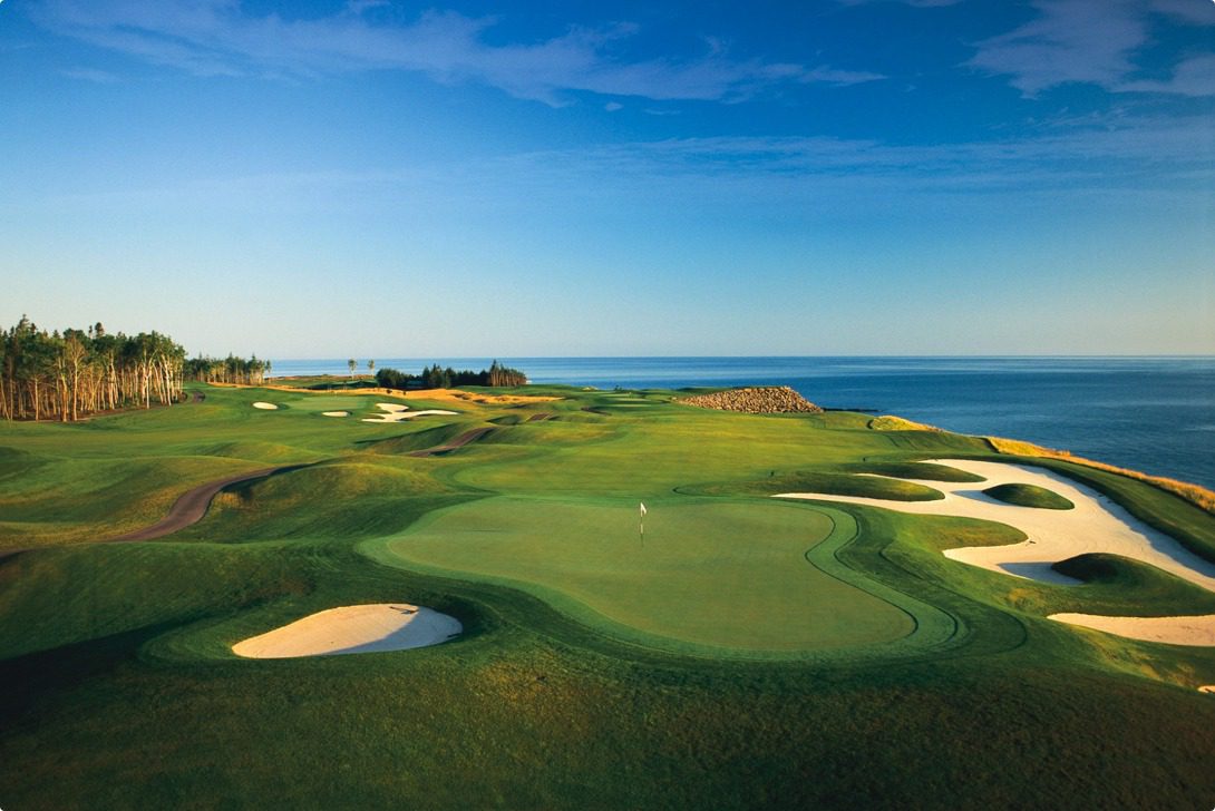 A golf course with a view of the ocean.