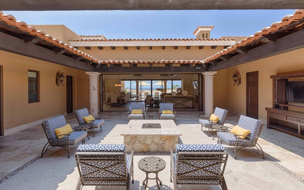 A patio with chairs and tables in it