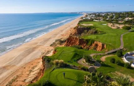 Golfer on a cliffside golf course overlooking the ocean.